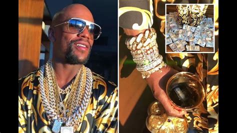 Big bottles for those big moments… Floyd Mayweather flaunts wealth by standing in pile of ...