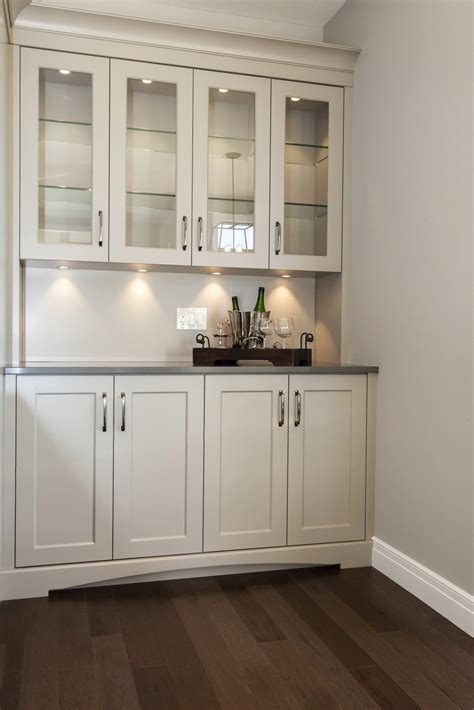 A kitchen and bath designer for more than 25 years, john is board certified and an active member of nkba and nari. Showcase style, custom cabinetry complete with spotlights for a dramatic kitchen beverage center ...