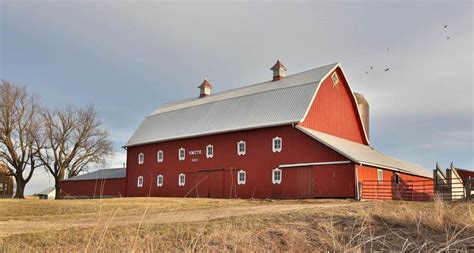 Horse and red barn in winter a beautiful winter scenic in alberta, canada. Smith Family Barn in Iowa Barn Foundation Magazine