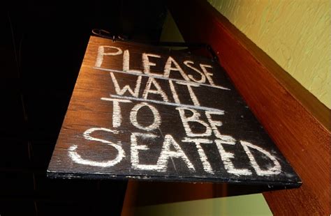 Please Wait To Be Seated Sign Stock Photo Download Image Now Istock