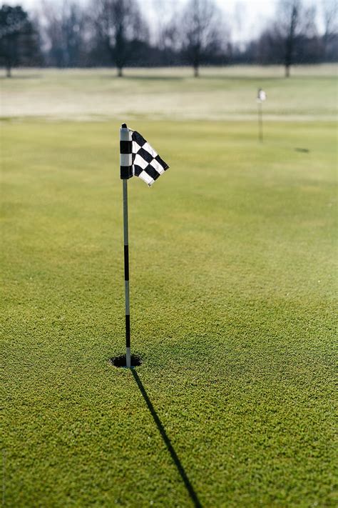 Putting Green Flag On Golf Course Del Colaborador De Stocksy Matthew