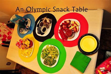 An Olympic Snack Table With Plates And Bowls