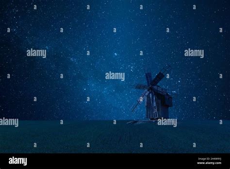 Night Landscape With Old Windmill In Field Bright Stars In Sky