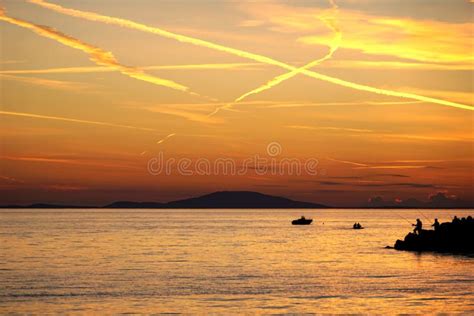 Burning Orange Dramatic Sky Above The Seascape At Sunset Stock Image