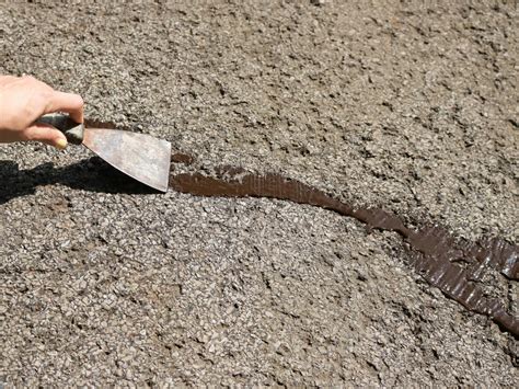 How To Fix Cracks In A Driveway And Apply A Coat Of Sealant How Tos Diy