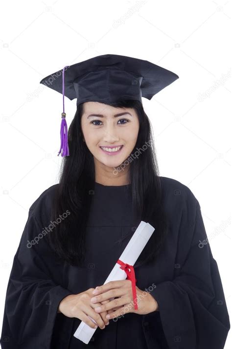 Download Portrait Of Happy Female Student In Graduation Gown Holding