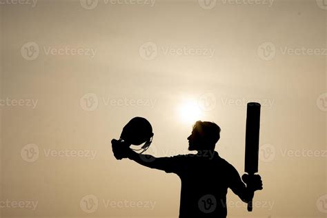 Silhouette Of A Cricketer Celebrating After Getting A Century In The