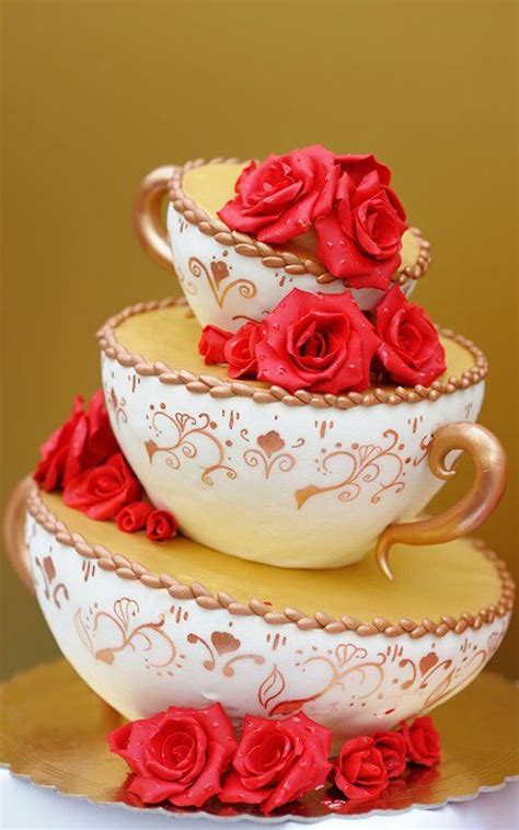 three white bowls with red roses are stacked on top of each other in gold trimmings