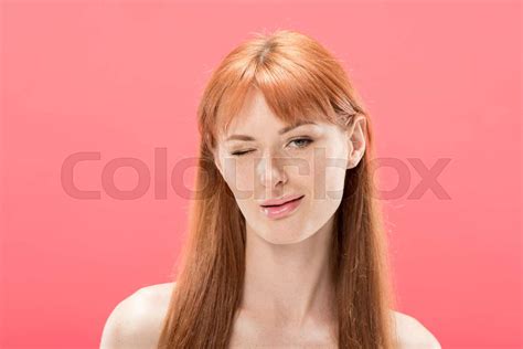 Front View Of Naked Redhead Girl Looking At Camera And Blinking