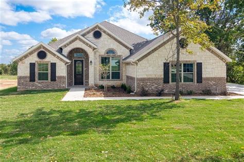View of lovers lane, springtown, texas on dec 24th 2009 during blizzard. 215 Elliott Ln, Springtown, TX 76082 | MLS# 13397351 | Redfin