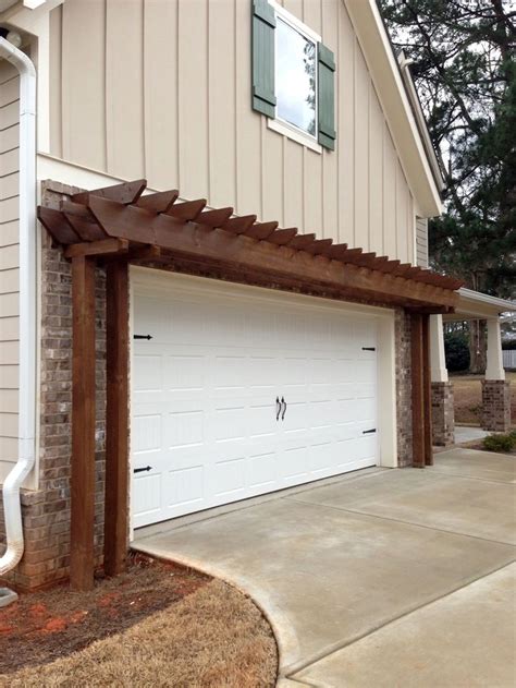 Wood pergolas that are used to decorate the exterior. Above Garage Door Trellis | Garage door trellis, Garage ...
