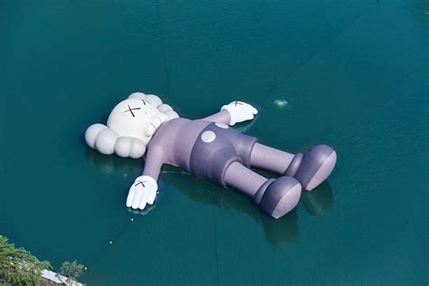 Kaws Holiday A Inflatable Kaws Floats On Seokchon Lake In Seoul