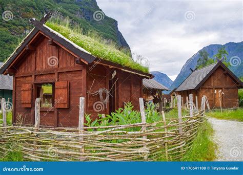 Traditional Norwegian Wooden Houses With Grass On The Roof In Norway