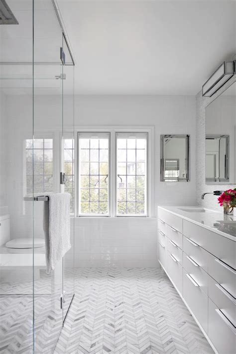 Contemporary Master Bathroom With Sleek Vanity And Chevron Tile Floor