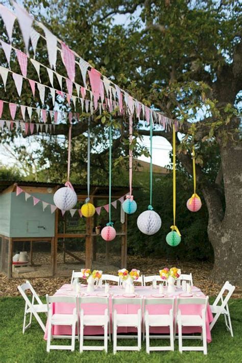 An Image Of A Table Set Up For A Party With Paper Lanterns Hanging From