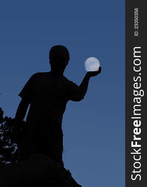 Silhouette Of Man Holding Moon Free Stock Images And Photos 23350356