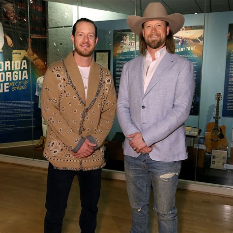 tyler hubbard and brian kelley support each other as duo celebrate fgl museum exhibit