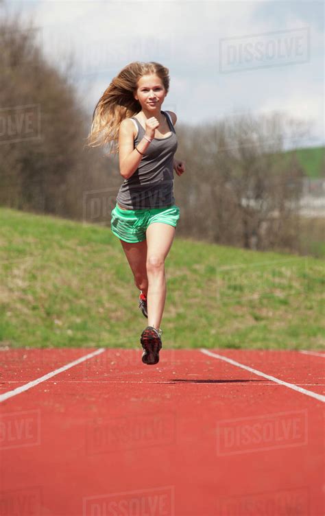 Austria Teenage Girl Running On Track Portrait Stock Photo Dissolve