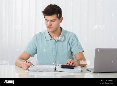 Man Calculating Tax Stock Photo Alamy