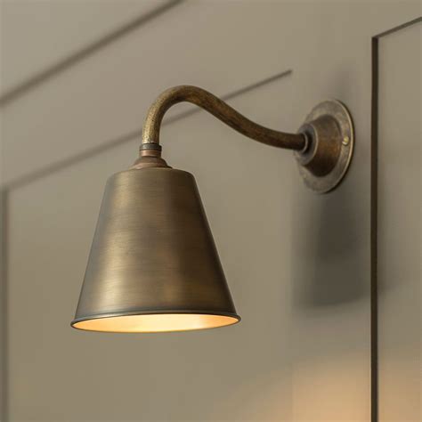 You can choose different styles in various sections of your house. Club Wall Light in Antiqued Brass | Wall lights, Wall ...