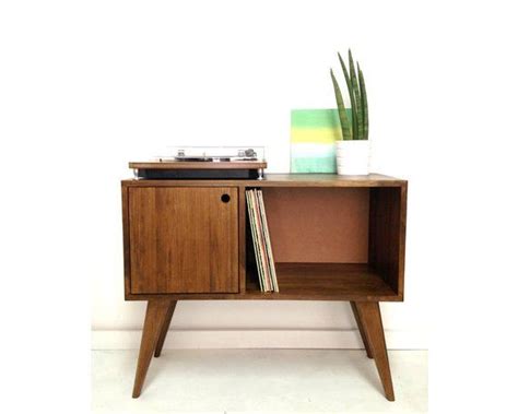 It is made from 1 thick wood and sits on top of custom hairpin legs. Vinyl Platten Schrank