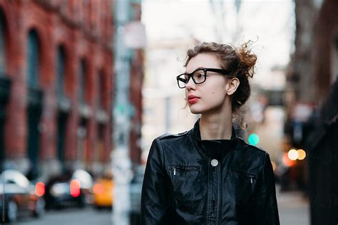attractive woman walking down the street in new york city by stocksy contributor michela