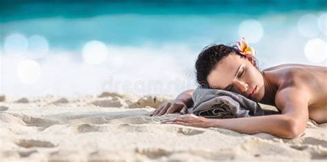 Beautiful Girl Lying Down Under The Sun Tanning In A Tropical Beach Stock Image Image Of