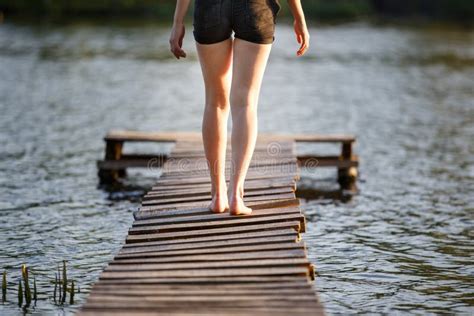Girl Strolling Along A Pier On Pond On Sunset Stock Image Image Of Girl Pond 93952287