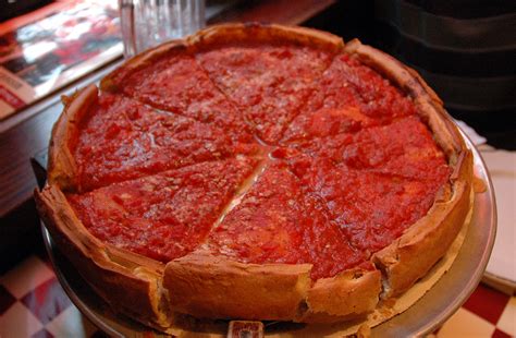 The pan in which it is baked gives the pizza its characteristically high edge which provides ample space for large amounts of cheese and a chunky tomato sauce. Chicago Style Pizza - Cook Diary