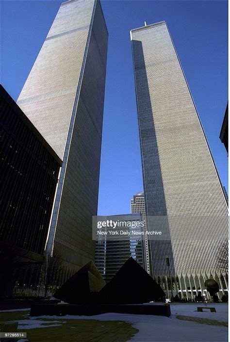 The Twin Towers Of The World Trade Center Loom Over Sculpture By
