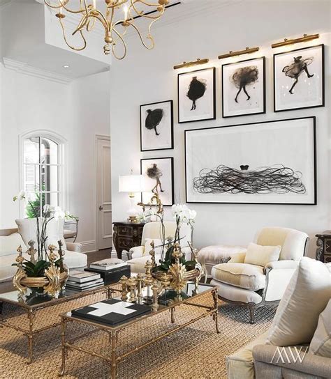 A 66″ settee or love seat and an 84″ sofa. Modern French living room features linen sofas facing each other across from two gold bamboo ...