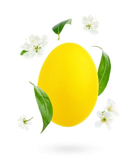Premium Photo Yellow Easter Egg Decorated With Flowers And Leaves On