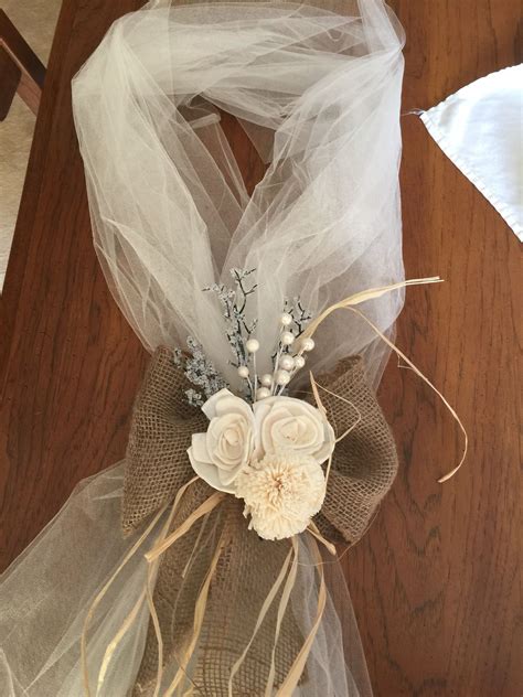 I've created the flower using lots of layers of tulle making the flower look fully and gorgeous, decorated with a large beautiful brooch. Tulle and burlap chair/ pew decor for upcoming wedding ...