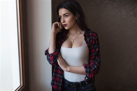 When it comes to fashion, black love wearing black all the time? Woman wearing black and red plaid flannel shirt standing ...