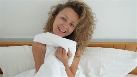 Young Cheerful Woman Smiling And Flirting In Bed Stock Footage Videohive