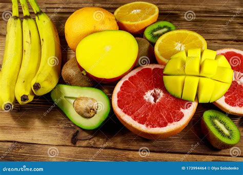 Assortment Of Tropical Fruits On Wooden Table Still Life With Bananas