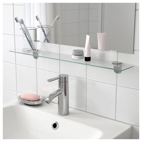 Make the most of what space you have by maximizing your walls with bathroom shelves. KALKGRUND glass shelf | IKEA Greece