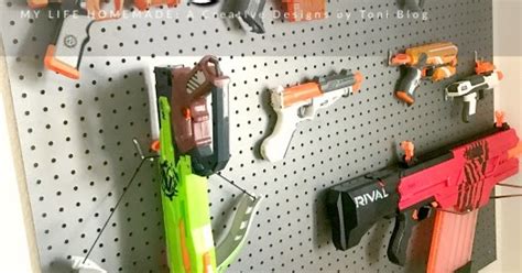 I have a super quick, but super effective organizing project today! my life homemade: DIY Nerf Gun Storage Wall