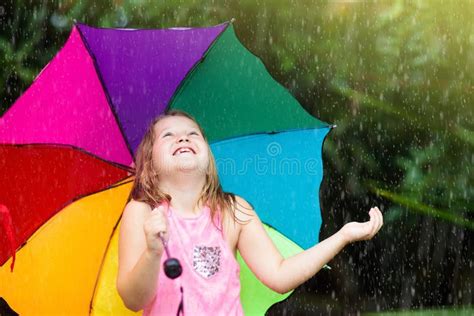 Kid With Umbrella Playing In Summer Rain Stock Image Image Of Active