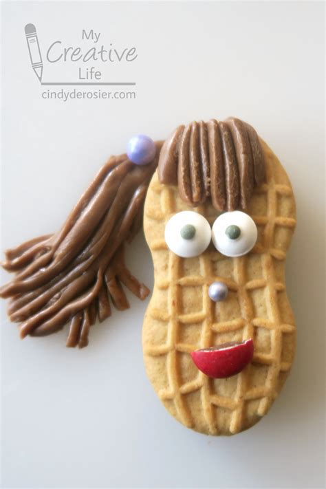 One pair of wireless earbuds and assorted packs of nutter butter peanut butter sandwich cookies. Nutter Butter People | Fun Family Crafts