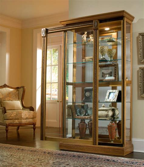 It is shown in a lovely estate oak finish adorned with glass doors and adjustable glass shelves for display items. Pulaski Furniture Curios 20484 Estate Oak Two Way Sliding ...
