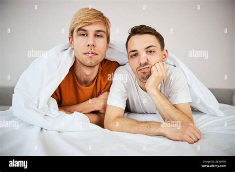 Cute Homosexual Couple Lying In Bed At Home Stock Photo Alamy