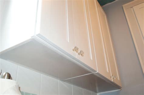 Label the location of the kitchen wall cabinets and appliances on the wall. CK and Nate header: Covering Up the Ugly
