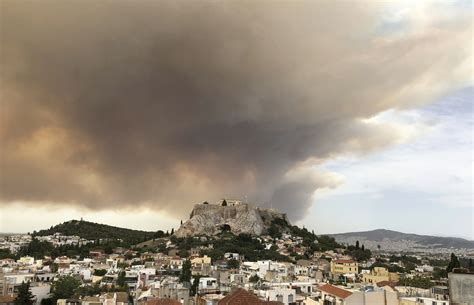 residents flee forest fire near greek capital of athens