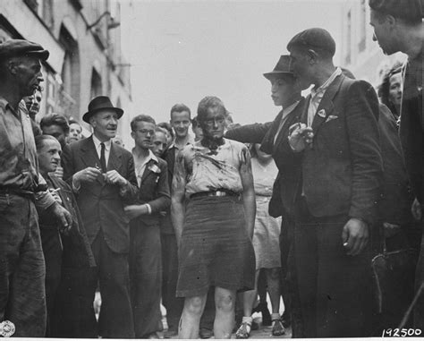 Civilians And Members Of The French Resistance Lead A Female