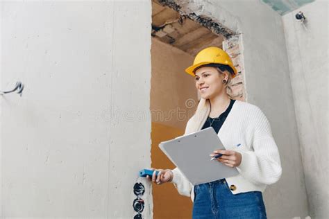 Foreman Designer Woman Inspecting Work Of Builder Construction In Apartment Checks Supervision