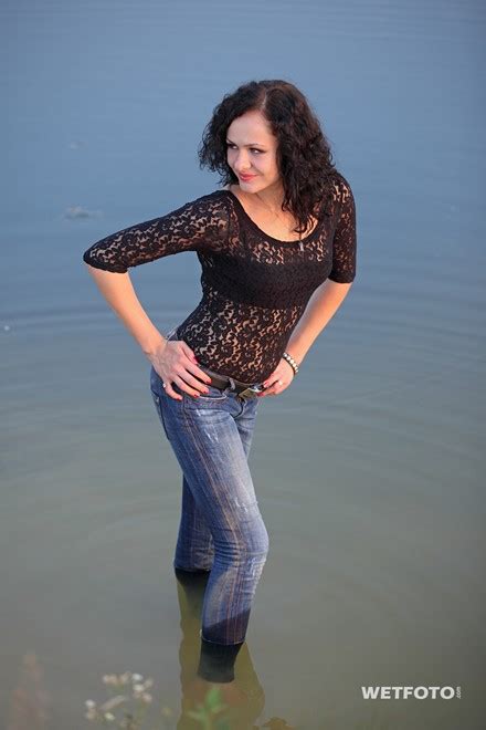 Wetlook By Curly Girl In Delicate Blouse Tight Jeans And Shoes By The Lake