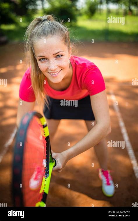 Feeling Confident On Tennis Courttop View Of Attractive Young Woman Tennis Player Serving On A
