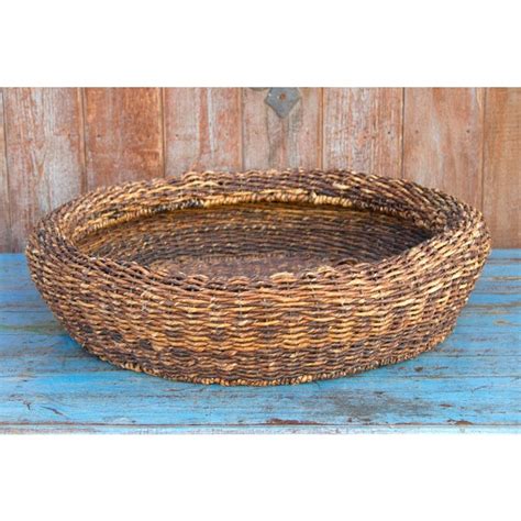 Large rattan floor baskets are the ideal home for extra blankets and throw pillows. Rattan Hand Woven Burmese Basket | Chairish