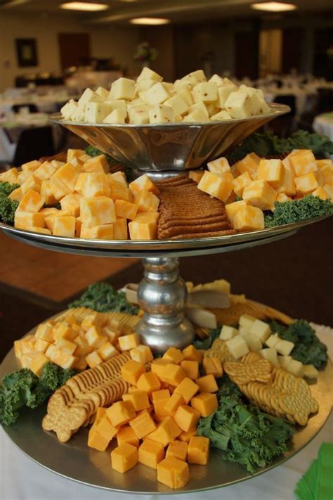 Stacking Rack With Different Cheese Cubes And Crackers For A Summer